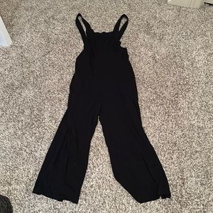 Black open back jumpsuit.